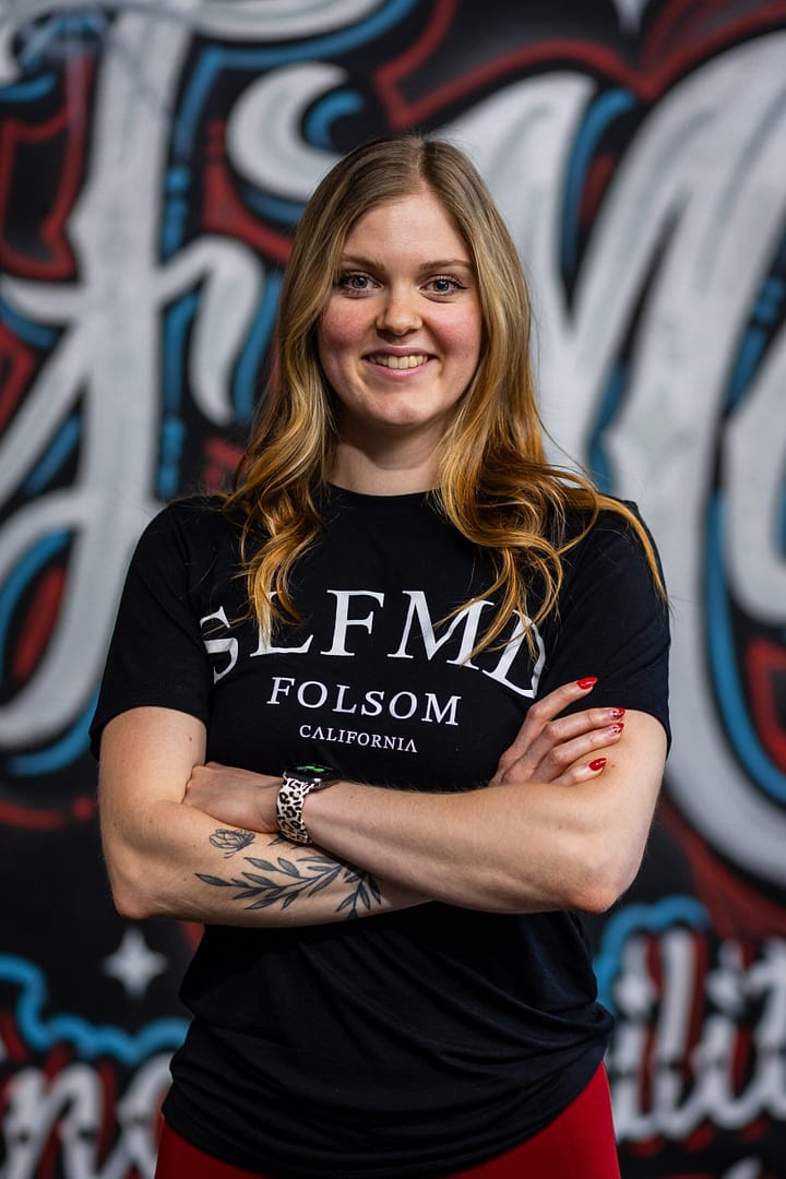 Carissa Tompkins, certified personal trainer at Self-Made Folsom, smiling and ready to help you achieve your fitness goals.